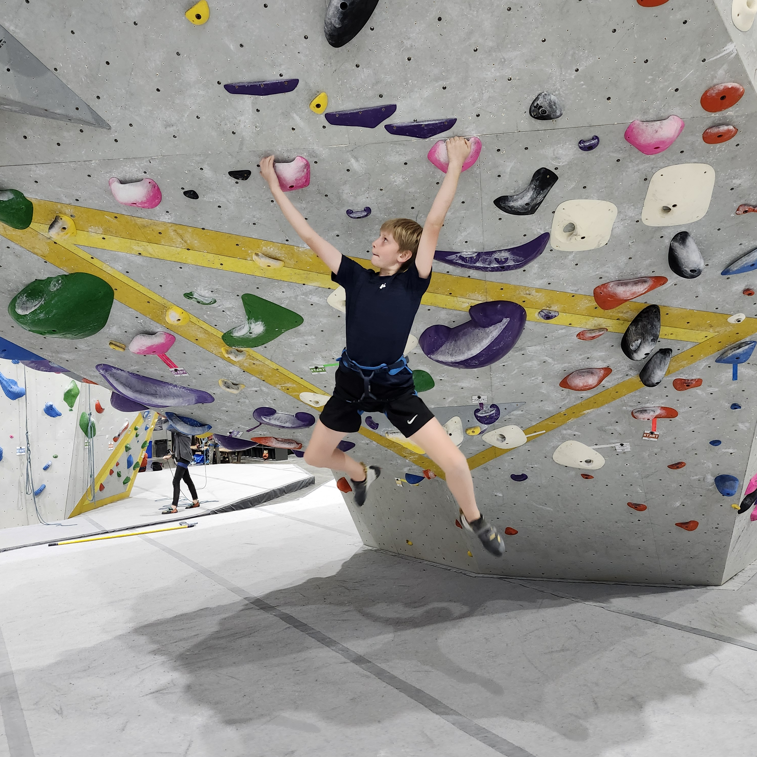 Climber on bouldering wall at Fiddlehead